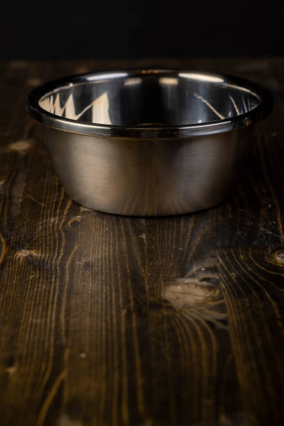 istock old stained stainless steel tableware on a black board 2186335716