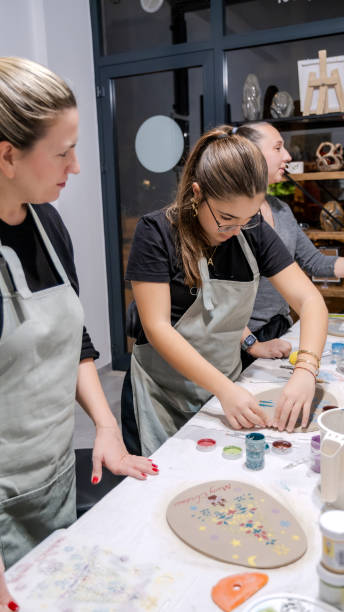 istock A young girl shapes clay in an art studio during an art activity 2186337722
