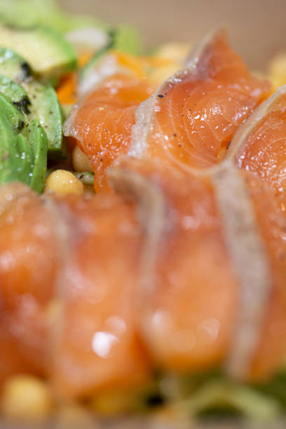Yummy raw salmon slices on a chickpea salad