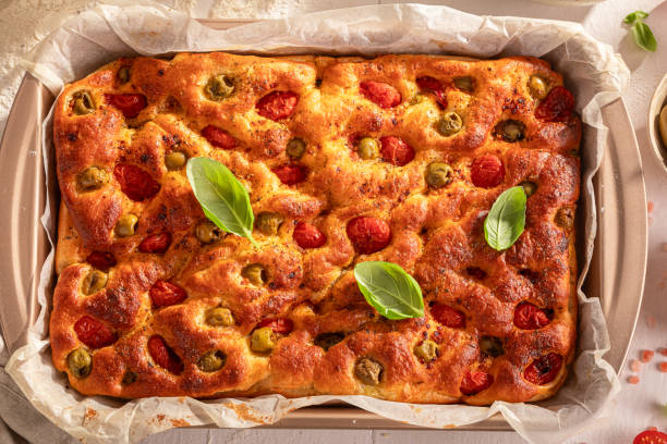 istock Hot focaccia baked in a rectangular baking tray. 2186345414