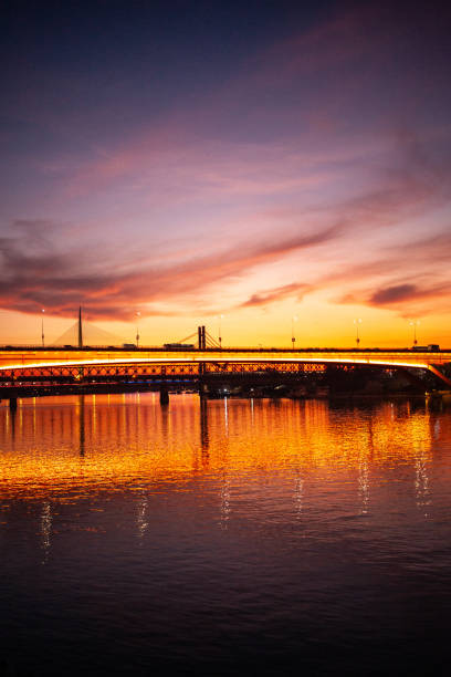Illuminated Gazela bridge over river Sava in Belgrade at sunset