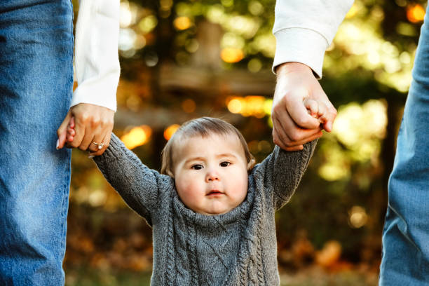 Parents Holding Baby's Hands