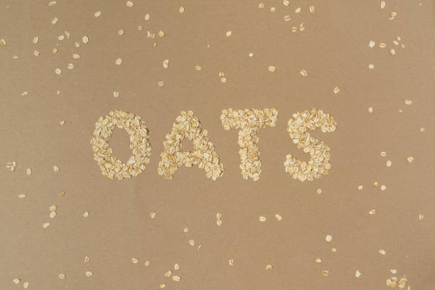 istock Oats word spelled out in whole rolled oat pieces with copy space 2186349798