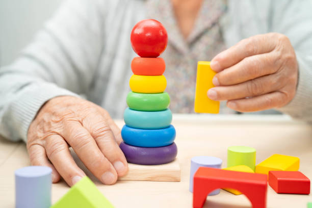 istock Asian elderly woman playing game. 2186354604