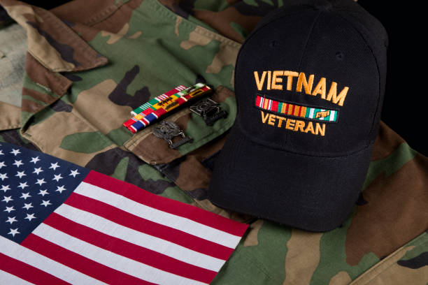 istock Vietnam veterans cap, camouflage jacket, and military decorations 2186355234
