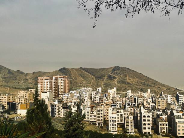 istock Hazy cityscape with a large hill 2186363315