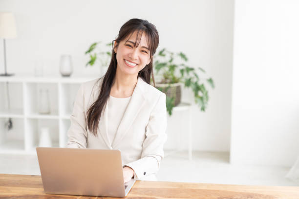 istock young asian businesswoman using laptop 2186366199