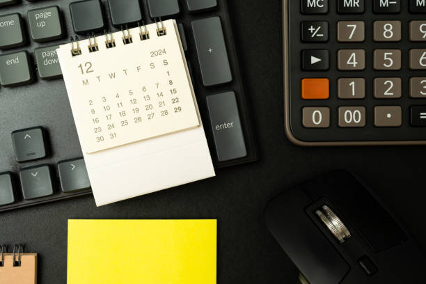 istock calendar on desk and other supplies. 2186368541