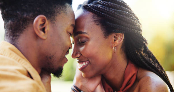 istock Love, forehead touch and black couple in park together for bonding, relationship and affection in nature. Relax, dating and happy man and woman outdoors for romance, embrace and commitment on weekend 2186376528