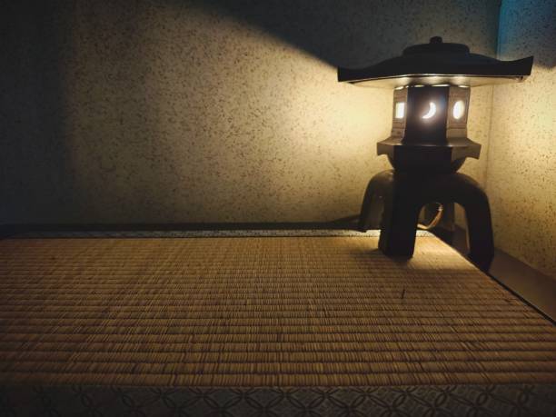 Lantern Japanese in a dark room with a lighted lamp.