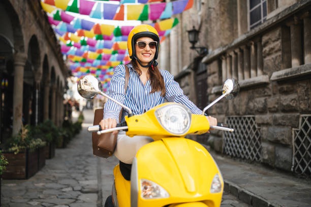 istock Female using moped to move around town. 2186379184