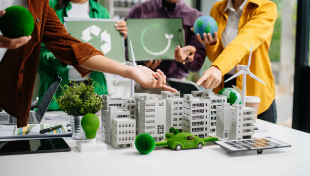 istock Sustainable innovation by young professionals for a greener future. Showcasing renewable energy solutions with solar panels, wind 2186382541