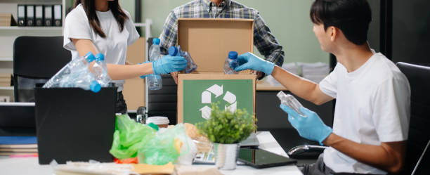 istock Eco-friendly teamwork with this office recycling scene. Perfect for showcasing sustainability, collaboration, 2186382546