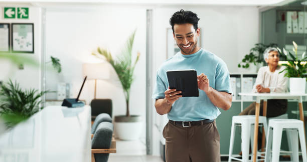 istock Creative, office and man with tablet, smile or planning online schedule at design agency. Scroll, research and happy consultant on digital app for business agenda, website idea or project inspiration 2186384056