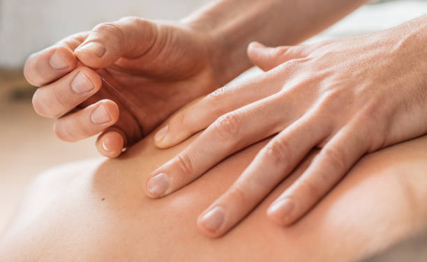Physiotherapist doing shiatsu and myofascial release therapy