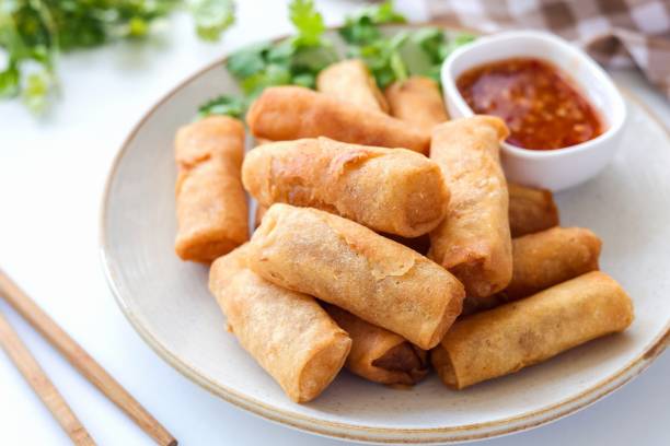 istock Deep fried vegetable spring rolls or egg rolls and sauce , Thai called popia on white background, vegetarian food 2186394050
