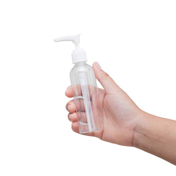 istock Hand holding a clear plastic pump bottle. isolated on white background 2186399727