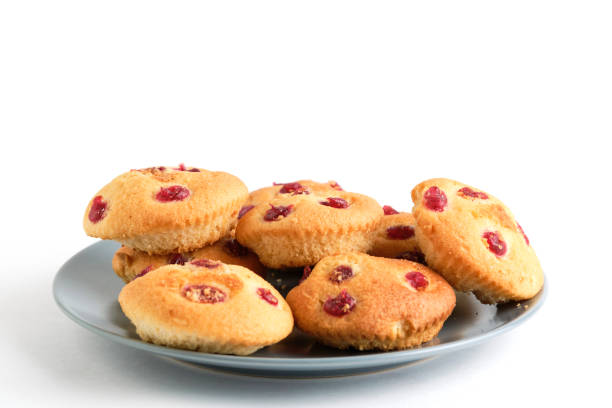 Cranberry muffin on a porcelain plate.