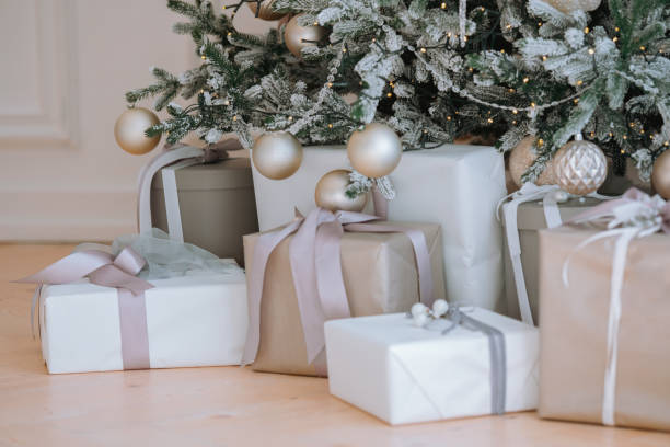 istock Beautifully wrapped gifts under a decorated Christmas tree in cozy setting 2186409579