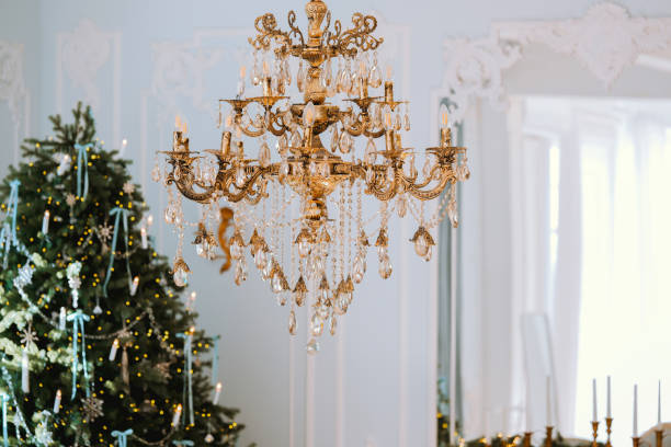 istock Elegant crystal chandelier illuminating a festive holiday setting 2186409586