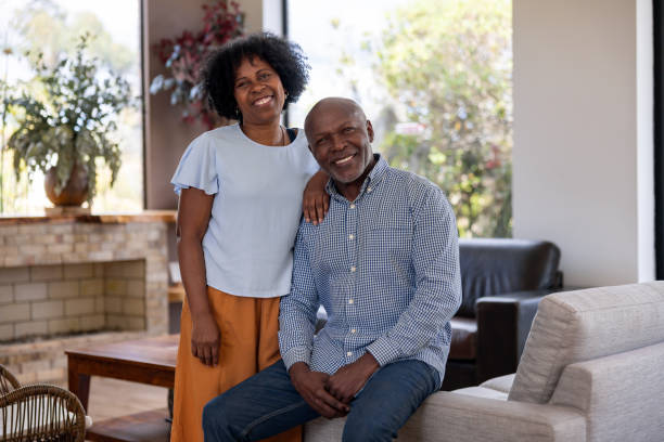 istock Happy senior couple smiling at home 2186412066