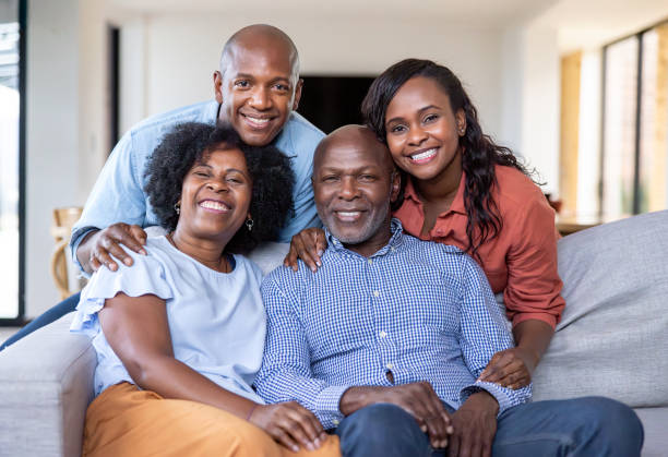 istock Two generation family smiling at home 2186412131