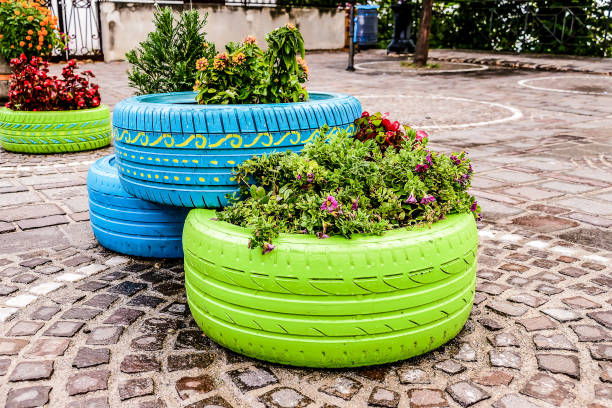 istock Old tires that are painted in assorted colors and used for a flo 2186412341
