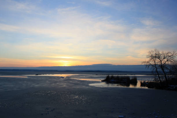 A winter view across the Boundary Bay area of the Fraser River Delta with the coastal mountains seen in the distance, British Columbia