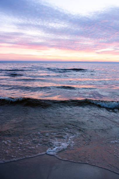 istock a colorful sky with the sun setting behind clouds 2186413126
