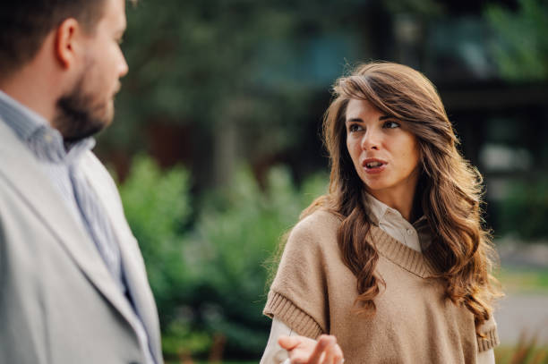 istock Young woman explaining herself during difficult conversation outdoors 2186416543