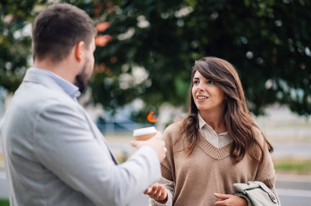 istock Business people talking and having coffee break outdoors 2186416614