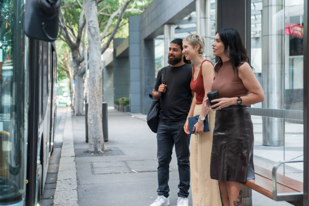 istock City commuters connecting at bus stop. 2186417369