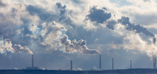 istock A large cloud of smoke is rising from a factory 2186418345