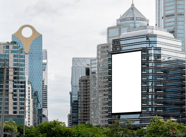 istock Mock up white vertical large LED display billboard on tower building with cityscape background .Clipping path for mockup 2186419196