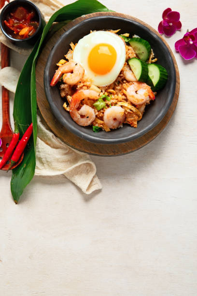 istock Nasi goreng- Indonesian fried rice with fried egg. 2186426518