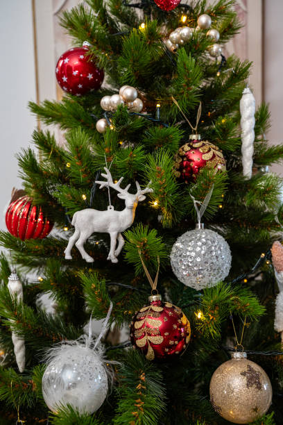 istock A Christmas tree with many ornaments, including a deer ornament. 2186426624