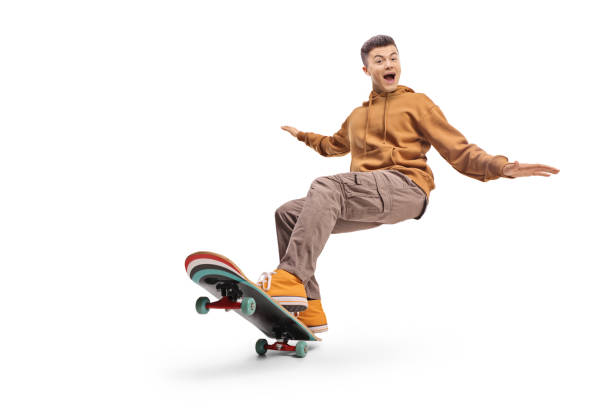 istock Excited young man riding a longboard 2186429438