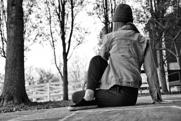Woman practicing yoga outdoors.