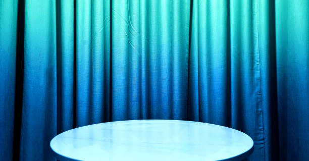 istock real empty round marble table with gradient neon blue curtain background used for premium, luxury, deluxe, technology concept. podium under spot light. 2186432526