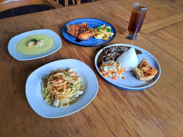 istock Spaghetti Alfredo With Chicken, Beef Bulgogi With Steamed Rice, Corn Soup With Crouton, Nashville Hot Chicken With French Fries. Fresh Tea Iced In Glass. Food And Drink Menu. 2186433030