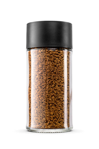 istock A clear glass jar is filled with instant coffee, displaying its rich brown texture isolated on white. 2186439535