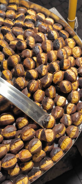 istock Roasted chestnuts sold on the street 2186439729