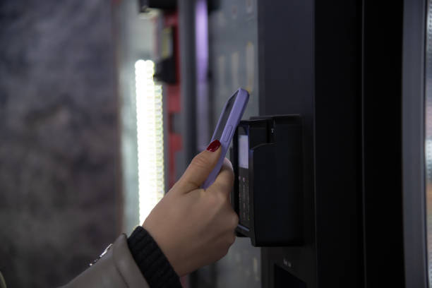 istock woman paying for purchase using smartphone 2186444717