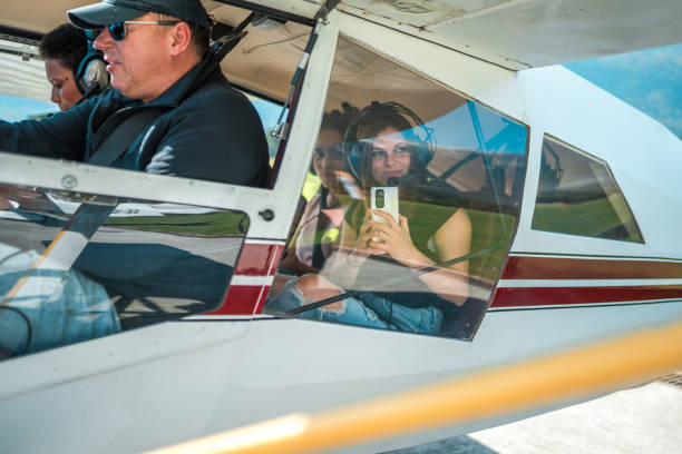 istock Diverse Group of Tourists Preparing for Scenic Flight in Light Aircraft 2186447131