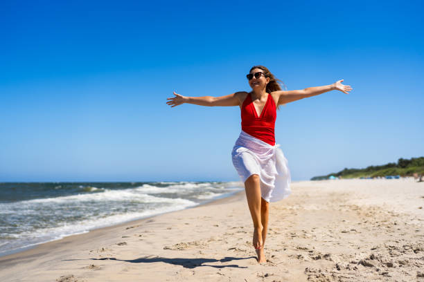 Mature woman enjoying vacation at the beach