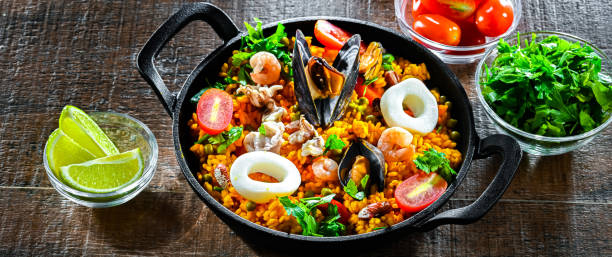 istock Seafood paella served in a cast iron pan 2186456751