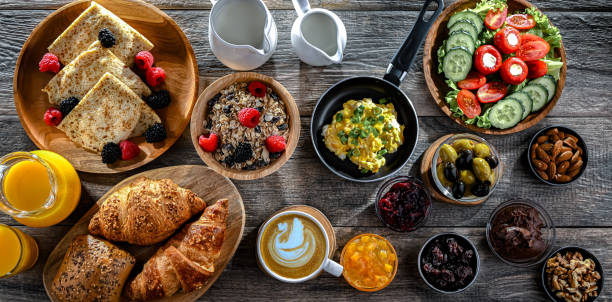 istock Breakfast served with coffee, eggs, cereals nd croissants 2186456993