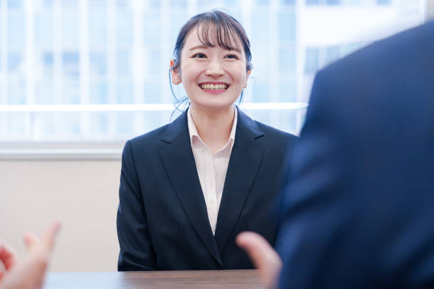 istock Female job hunter smiling during an interview. 2186457575