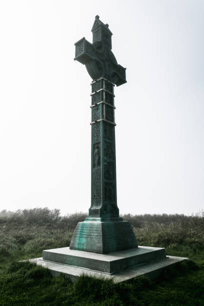 July 22, 2025 Killarney, Ireland A beautifully detailed monument, gracefully flanked by lush greenery, set against a vibrant, modern urban backdrop