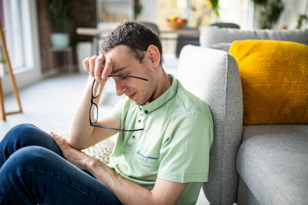 istock Thoughtful man gazing down, glasses resting on head 2186458804